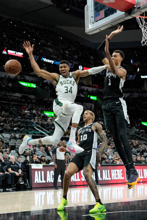 Jan 4, 2024; San Antonio, Texas, USA; Milwaukee Bucks forward Giannis Antetokounmpo (34) loses control of the ball while driving to the basket against San Antonio Spurs forward Victor Wembanyama (1) during the first half at Frost Bank Center.